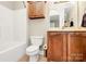 Bathroom features tub, toilet, vanity, cabinet, and towel rack at 4205 New Town Rd, Waxhaw, NC 28173
