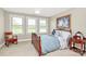 Bedroom with carpeted floor, rocking chair, and three bright windows at 4205 New Town Rd, Waxhaw, NC 28173