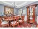 Elegant dining room featuring a large table, china cabinet, and decorative accents at 4205 New Town Rd, Waxhaw, NC 28173