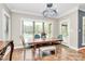 Charming dining room featuring a wooden table with a bench and chairs, with a view of the pool at 4205 New Town Rd, Waxhaw, NC 28173