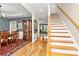 Bright foyer with hardwood floors, elegant staircase, and access to the dining and living areas at 4205 New Town Rd, Waxhaw, NC 28173