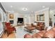 Inviting living room showcasing stone fireplace, a comfortable seating area and a decorative mirror at 4205 New Town Rd, Waxhaw, NC 28173