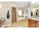 The spacious main bathroom includes a walk-in shower, soaker tub, and separate vanities at 4205 New Town Rd, Waxhaw, NC 28173