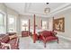 Bright main bedroom with large windows, a tray ceiling, and comfortable seating area at 4205 New Town Rd, Waxhaw, NC 28173