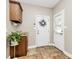 A functional mud room features built-in cabinetry, convenient sink, and easy backyard access at 4205 New Town Rd, Waxhaw, NC 28173