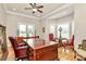 Well-appointed office with a large wooden desk, leather chairs, and plenty of natural light at 4205 New Town Rd, Waxhaw, NC 28173