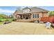 Spacious patio with covered area and outdoor seating, perfect for entertaining at 4205 New Town Rd, Waxhaw, NC 28173