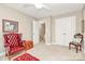 Sitting room with red leather furniture, carpeted floor, and two closets at 4205 New Town Rd, Waxhaw, NC 28173