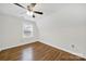 Bright bedroom features hardwood floors, natural light and neutral paint create a warm and inviting atmosphere at 4601 Crooked Oak Ln, Charlotte, NC 28226