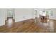 Open concept kitchen/dining room featuring hardwood floors and plenty of natural light at 4601 Crooked Oak Ln, Charlotte, NC 28226
