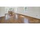 Bright dining area with ample natural light, chair rail detail, and hardwood floors at 4601 Crooked Oak Ln, Charlotte, NC 28226