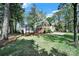 Charming home with a well-manicured lawn and mature trees, providing ample shade and curb appeal at 4601 Crooked Oak Ln, Charlotte, NC 28226