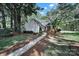 Charming single-Gathering home with well-manicured lawn, mature trees, and inviting walkway create great curb appeal at 4601 Crooked Oak Ln, Charlotte, NC 28226