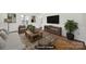 This staged living room provides furniture ideas and layout of this space, creating a comfortable ambiance at 4601 Crooked Oak Ln, Charlotte, NC 28226