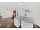Open floor plan from kitchen island, hardwood floors, fireplace, and natural light at 4601 Crooked Oak Ln, Charlotte, NC 28226