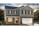 Charming two-story home featuring stone accents and a welcoming front entrance, plus a two car garage at 5227 Reedy Ridge Rd, Charlotte, NC 28215