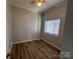 Neutral bedroom with hardwood floors and a window at 715 N Church St # 301, Charlotte, NC 28202