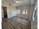 Bright bedroom with wood-look floors, ample natural light, and closet at 715 N Church St # 301, Charlotte, NC 28202