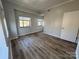 Bedroom featuring wood-look flooring and natural light at 715 N Church St # 301, Charlotte, NC 28202