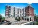 Modern exterior elevation of condo building with balconies at 715 N Church St # 301, Charlotte, NC 28202