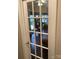 Glass paned door opening into room with hardwood floors and decor at 7218 Alexander Farm Rd, Monroe, NC 28110
