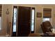 Inviting foyer featuring a wood door with sidelights and window offering natural light and a welcoming entrance at 7218 Alexander Farm Rd, Monroe, NC 28110