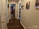 Hallway featuring hardwood floors and neutral-toned walls at 7218 Alexander Farm Rd, Monroe, NC 28110