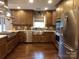 A kitchen featuring stainless steel appliances, granite countertops and wooden cabinetry at 7218 Alexander Farm Rd, Monroe, NC 28110