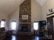 A spacious living room with a stone fireplace and wood mantle at 7218 Alexander Farm Rd, Monroe, NC 28110