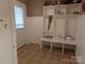 Mud room featuring built in storage and tile floors at 7218 Alexander Farm Rd, Monroe, NC 28110