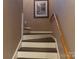 Interior staircase with freshly painted white risers and dark treads leading to the upper level of the home at 7218 Alexander Farm Rd, Monroe, NC 28110
