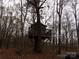 Unique treehouse nestled among the trees, offering a secluded escape at 7218 Alexander Farm Rd, Monroe, NC 28110