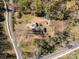 Expansive lot featuring a dwelling, multiple outbuildings and a paved drive at 724 Rocky River W Rd, Charlotte, NC 28213