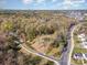 Overhead shot of a sprawling landscape showcasing mature trees and nearby roads at 724 Rocky River W Rd, Charlotte, NC 28213