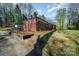Exterior shot of the property from the side, featuring the driveway and yard at 724 Rocky River W Rd, Charlotte, NC 28213