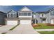 Charming new construction townhome with a two-car garage and beautifully landscaped front yard at 7865 Iron Rd, Sherrills Ford, NC 28673