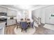 Cozy dining area near kitchen features hardwood floors and access to the front entry at 7869 Iron Rd, Sherrills Ford, NC 28673