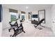 Bright workout area with modern exercise equipment, mirrors, and natural light for fitness enthusiasts at 7869 Iron Rd, Sherrills Ford, NC 28673