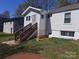 Backyard view featuring siding and wooden stairs at 813 North Ave, Charlotte, NC 28208