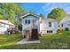 Charming home exterior with a stairway leading up to the front entrance at 813 North Ave, Charlotte, NC 28208