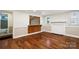 Inviting living room with hardwood floors, decorative wood accent, and ample natural light at 813 North Ave, Charlotte, NC 28208