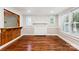 Cozy living room featuring hardwood floors, a fireplace, and bright windows at 813 North Ave, Charlotte, NC 28208