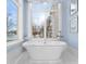 Relaxing bathroom with freestanding tub and a stunning view of the water at 8228 Bay Pointe Dr, Denver, NC 28037