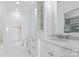 This luxurious bathroom has double sinks, a marble floor, and a shower/tub combo at 8228 Bay Pointe Dr, Denver, NC 28037