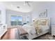 Bedroom with hardwood floors, sitting area, lake views and lots of natural light at 8228 Bay Pointe Dr, Denver, NC 28037
