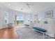Bedroom boasts water views, hardwood floors, and two beds with bright white linens at 8228 Bay Pointe Dr, Denver, NC 28037