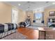Well-lit bedroom with hardwood floors, three beds, and a built-in window bench at 8228 Bay Pointe Dr, Denver, NC 28037