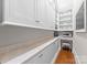 Convenient butler's pantry with a beverage center and plenty of cabinet and countertop space at 8228 Bay Pointe Dr, Denver, NC 28037
