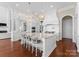 Gourmet kitchen features a large island, pendant lighting, marble countertops, and stainless steel appliances at 8228 Bay Pointe Dr, Denver, NC 28037