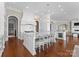 Spacious gourmet kitchen features a center island with seating, high-end appliances, and custom cabinetry at 8228 Bay Pointe Dr, Denver, NC 28037